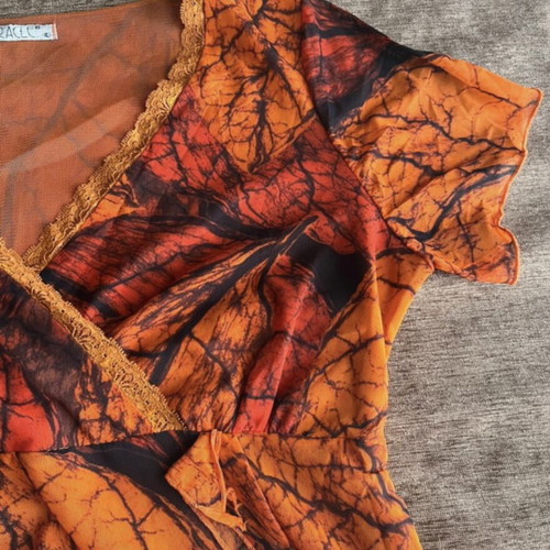 Miracle blouse like new, black and orange, size XL
