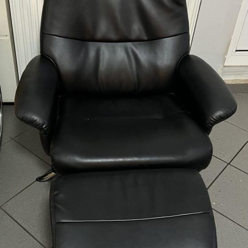 Leather armchair and footstool used, black, with recline