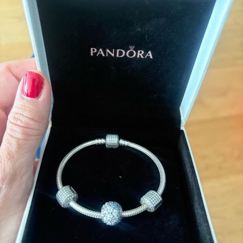 Pandora silver bracelet new with 4 charms and zirconia