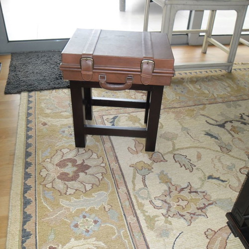 Leather folding table used with suitcase-shaped storage space