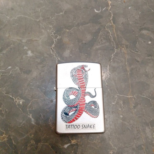 Zippo lighter used with snake design