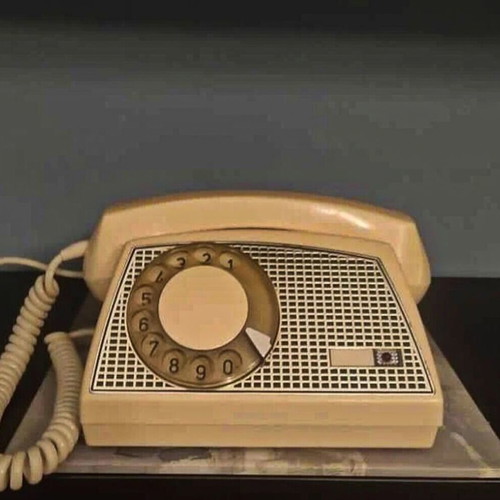 Vintage telephone from 1960 beige with silver mesh in like new condition