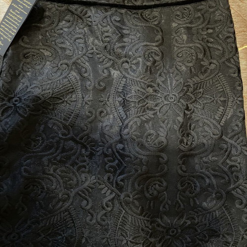Zinas black mini pencil skirt made of embossed brocade fabric