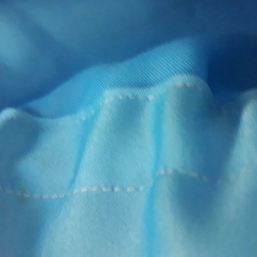 Shoulder bag handmade from white lace with sky blue satin