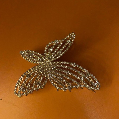 Metal hair clips like new, 3 gold with designs
