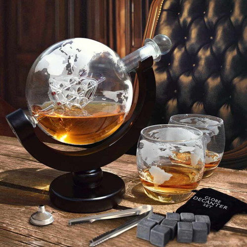 Glass decanter with globe design and accessories, new