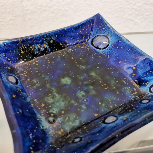 Decorative plate used, blown glass blue with green and yellow elements