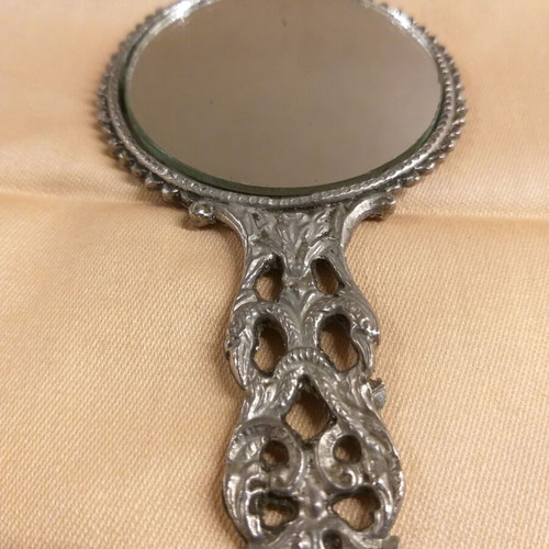 Carved old hand mirror used