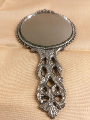 Carved old hand mirror used