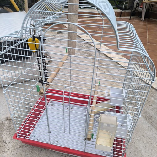 Metal birdcage like new with perches and feeders