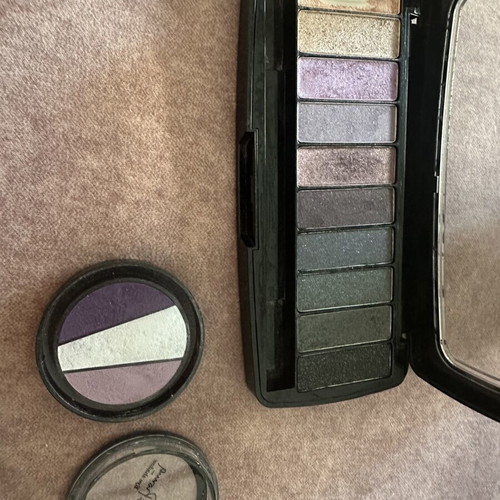 Wet and Wild eyeshadow palette and assorted lip products