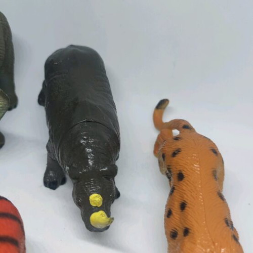 Plastic jungle animals and small dinosaurs used