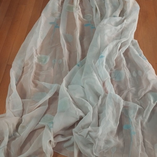 Semi-transparent curtain with soft floral patterns