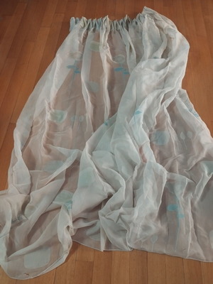 Semi-transparent curtain with soft floral patterns