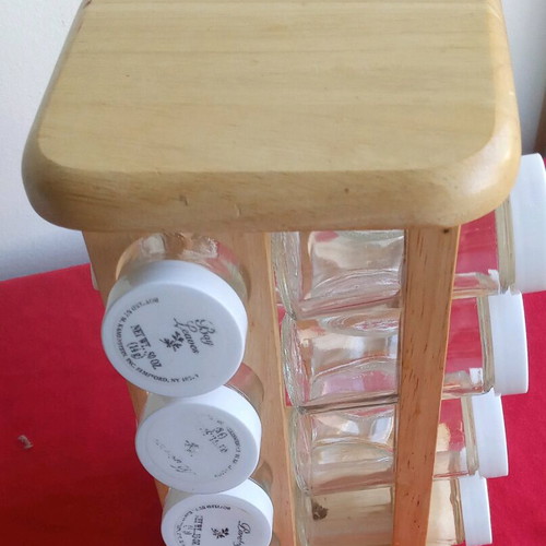Spice jars used in wooden rotating rack with 16 glass containers