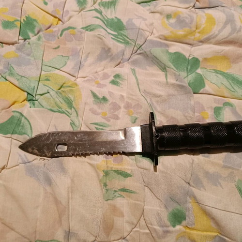 Survival knife used with needles, threads and compass
