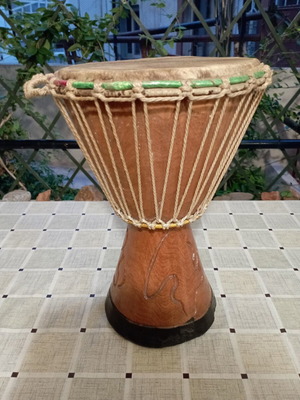 Traditional African djembe drum, carved wood and natural skin