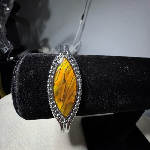 Adjustable bracelet like new, orange and silver