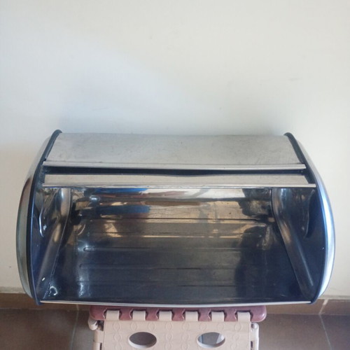Metal bread box with two dents