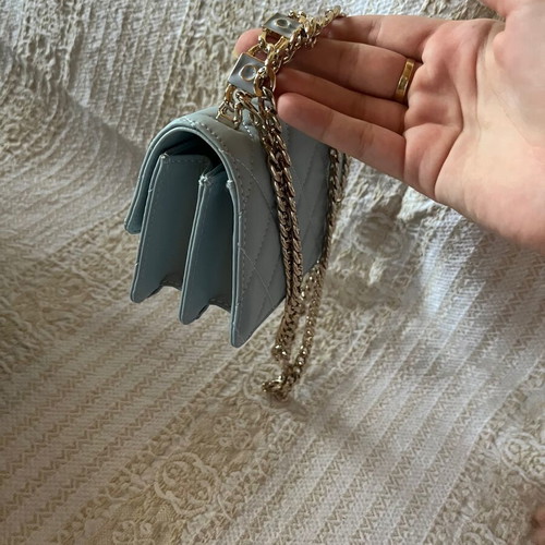 Leather baby blue handbag like new with gold chain and full packaging