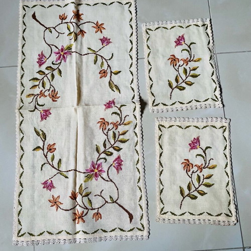 Set of handmade embroidered table linens used
