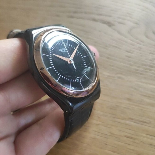 Swatch Black Nachtigall wristwatch YWB403, black dial with rose gold accents