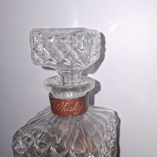 Whiskey bottle with aristocratic crest