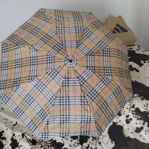 Vintage unisex folding umbrella with wooden handle, used