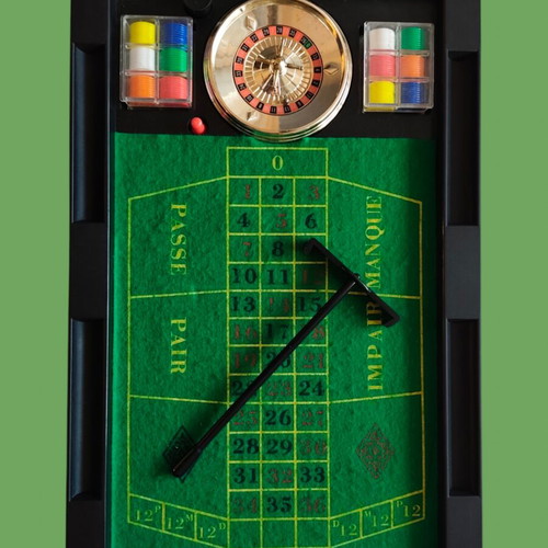 Retro tabletop roulette set used with chips and box