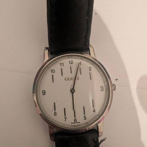 Gucci vintage women's wristwatch, stainless steel, black leather strap