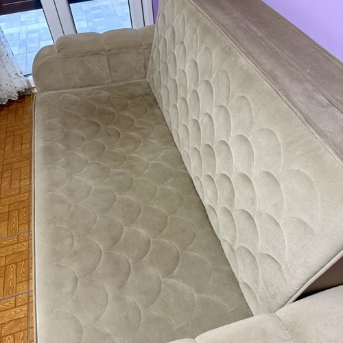 Two-seater sofa light brown/grey like new, folds into a bed