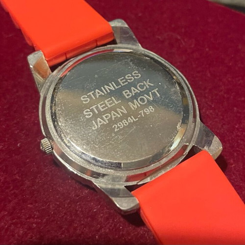 Women's wristwatch like new with red silicone strap and silver case