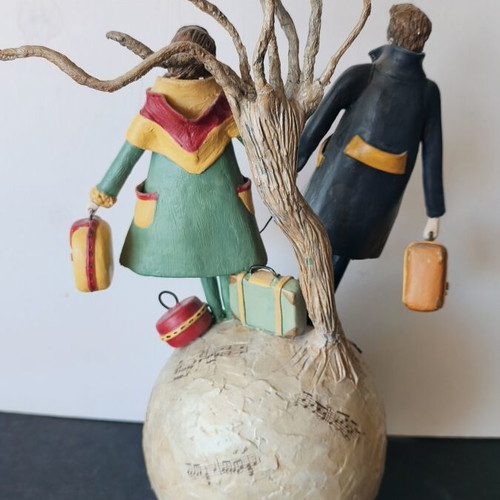 Handmade sculpture couple on globe by Nasia Soul
