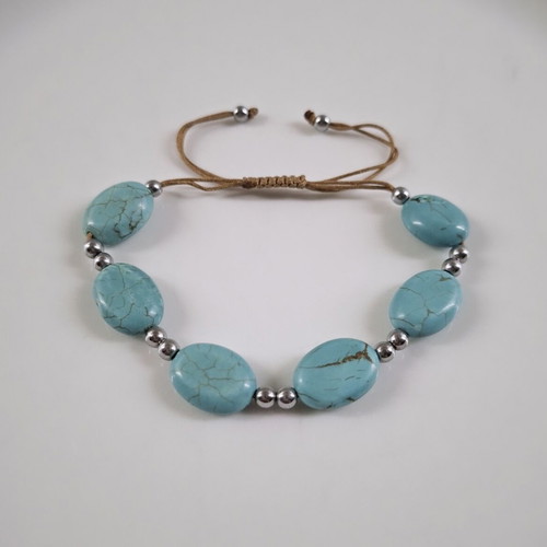 Handmade turquoise bracelet with silver details, adjustable cord