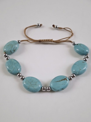 Handmade turquoise bracelet with silver details, adjustable cord