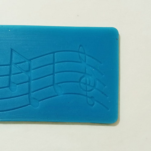 Silicone mold with musical theme pentagram, notes and treble clef like new
