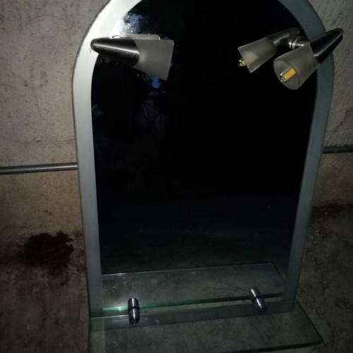 Semi-circular bathroom mirror used with 2 lights and shelf