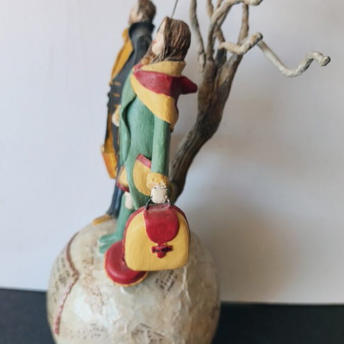 Handmade sculpture couple on globe by Nasia Soul