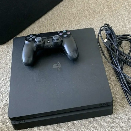 PlayStation 4 Slim console with charging dock, like new