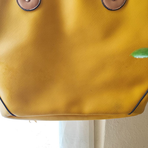 Yellow handbag used with beige details