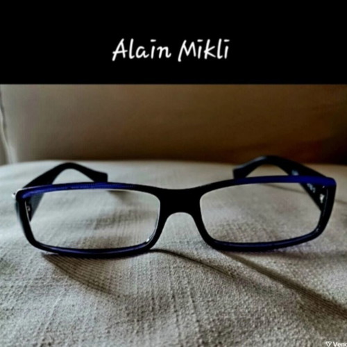 Alain Mikli eyeglasses used with hard case, black and purple