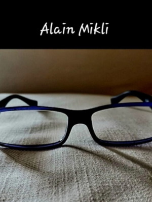 Alain Mikli eyeglasses used with hard case, black and purple