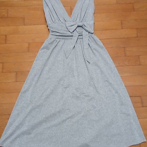 Dress gray silver with V neckline and bow tie at waist size Medium like new