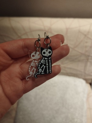 Skeleton cat earrings, pair, black and transparent