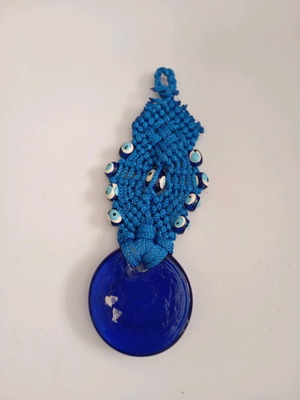 Glass eye charm used