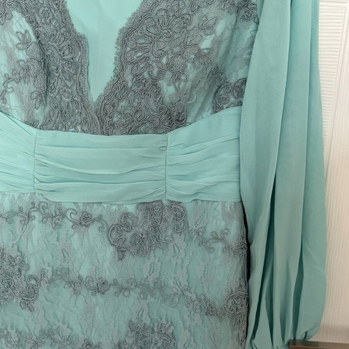 Long turquoise dress with lace embroidery and satin details