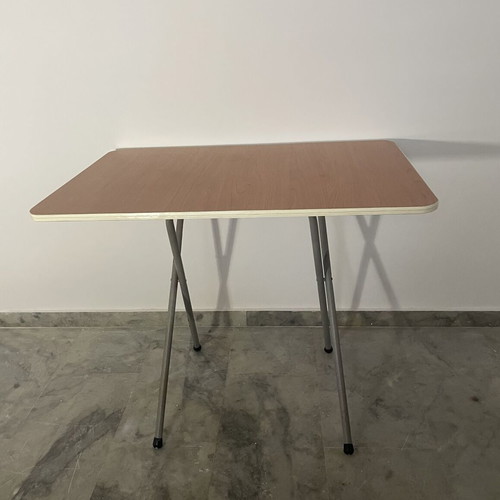 Folding table used with metal base and brown melamine top