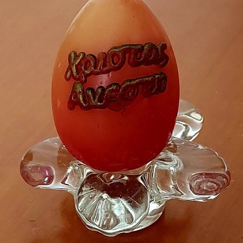 Easter decorative egg-shaped candle like new with glass base
