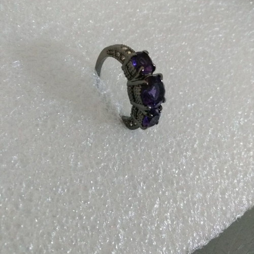 Ring with Purple Crystals and Black Plated Finish like new