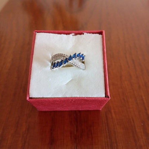 Ring new, gold plated with blue and silver zircon stones, size 7